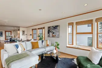 Living room to dining room, leads to large back deck and alley off street parking (upper level 2)