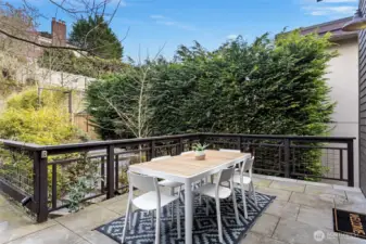 Large back deck connects to alley off street parking area (upper level 2)