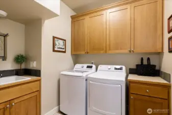 Main level utility room with sink off garage