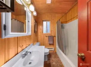 Full bathroom on main floor with tub and shower