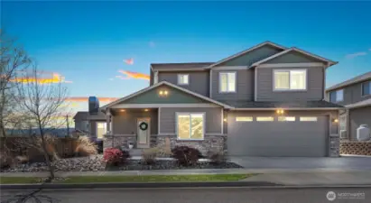 Spacious 3-car garage with front parking and large RV side parking.