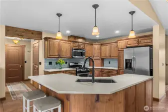 Spacious kitchen with ample storage and convenient walk-in pantry nearby.