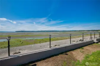 Concrete bulkhead protecting property from tides