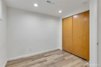 One of the downstairs bedrooms.