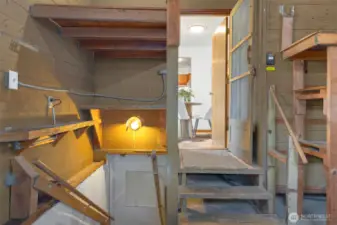 The open door leads to the dining area and kitchen. You can use these stairs to access the lower unit from inside the house.
