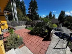 Landscaped Patio with Garden and Sitting Area in Front Yard