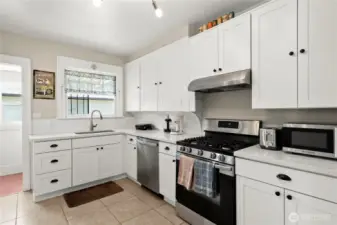 Newer cabinets, stainless steel appliances, tile floor