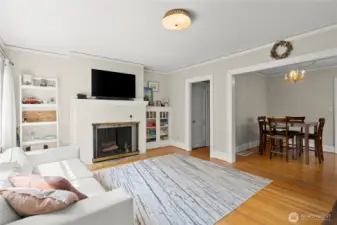 Light filled living room with wood burning fireplace