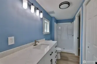 Another closet, oversized vanity and shower