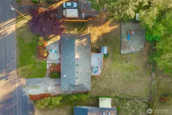 Top-down view showing the full property footprint — generous yard space, patio, and play area — all thoughtfully arranged for comfort and outdoor enjoyment.
