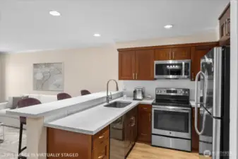 Quartz countertops and cherry wood cabinets