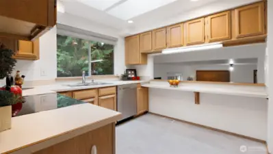 Like many classic tri-level homes, the main level opens to the lower level for connection and flow. The breakfast bar makes it easy to stay part of the conversation with anyone relaxing in the family room below.