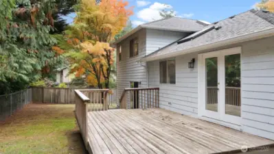 The large back deck connects seamlessly to the dining room through the beautiful French doors. It’s an easy extension of your living space - perfect for outdoor dining or soaking up a little sunshine.