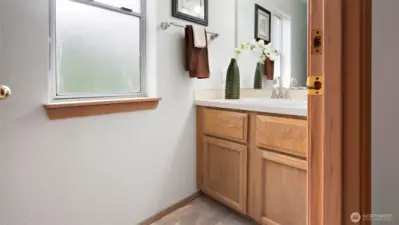 You’ll find new fixtures and a new mirror here too, giving this half bath a fresh, polished feel that ties in beautifully with the rest of the home.