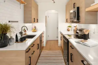 Kitchen showing secondary exit door.