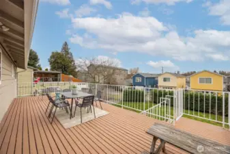 Fabulous open deck off the kitchen with stairs to the back yard.