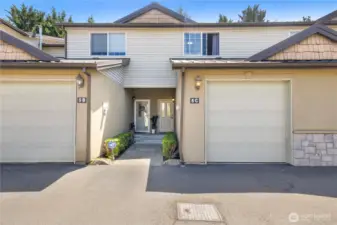 Unit 5C on the right side. The garage leads into  the home from the inside.