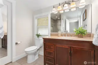 Primary bathroom off bedrooms has tile walk-in shower, heated tile floors and walk-in closet