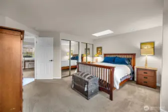 Comfortable primary suite features good size closets and private 3/4 bath