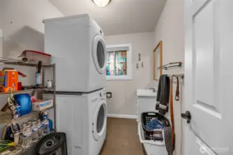 Landry room with 1/2 bath and more storage.