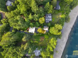 View of the home and waterfront beach. The homes ownes 120 feet of beach font