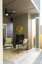 Covered patio with outdoor fireplace.