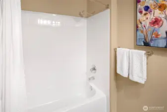 A classic combo that’s ready for a soak or a rinse—plus freshly tiled walls and a clean, minimalist look.
