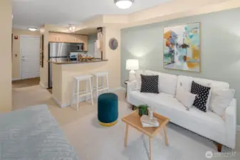 Everything you need is right here: a comfy sitting area, an inviting breakfast bar, and seamless flow from kitchen to couch.