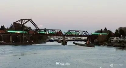 Boeing fusilages pass on the famous Salmon Bay bascule bridge.