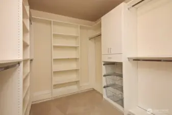 Your walk-in closet has been upgraded with built-ins.
