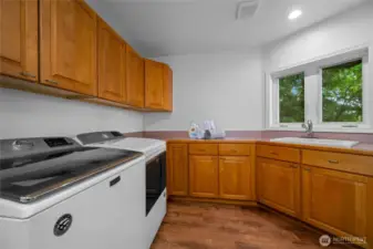 Laundry and storage areas designed with function and flexibility in mind.