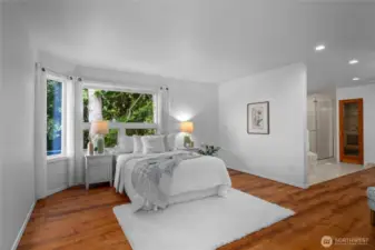 Tranquil main-floor primary suite with private deck access and spa-like ensuite.