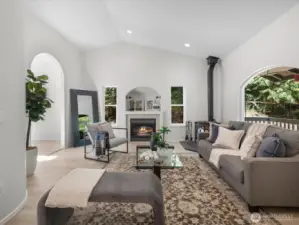 Step inside to an inviting living space flooded with natural light. Large windows bring the outdoors in, while the new flooring underfoot adds warmth and cohesion.