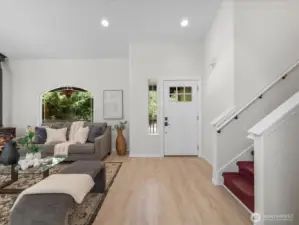 A brand-new front door offers a warm welcome and hints at the stylish updates inside.