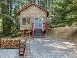At the back of the property, a 16x16 outbuilding invites imagination.