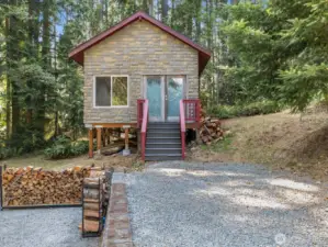 At the back of the property, a 16x16 outbuilding invites imagination.
