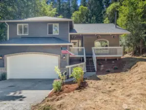 Front of the home. Freshly painted exterior and new garage door.