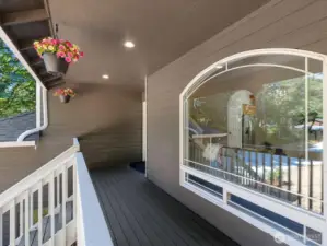 Freshly painted exterior includes front deck and railing.