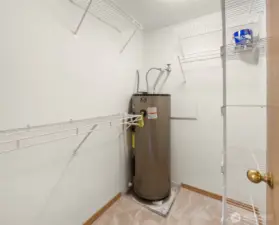 Walk in closet hosts the hot water heater