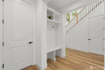 Custom built in bench/storage right off garage.