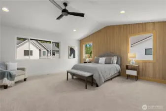 Upper level primary suite with vaulted ceilings