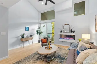 Spacious living room with fan to keep you cool.