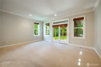 Large Primary Bedroom with a door to the covered patio. En-suite and walk-in closet