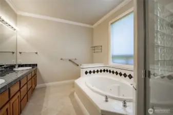 Primary Bathroom. Shower to the right and the walk-in closet to the left. Dual Vanities