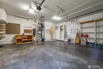 2 car garage with central vac, Newer High efficiency furnace and A/C. Lots of built-in storage too.