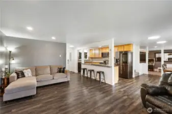 Open floor-plan with kitchen that overlooks living room.
