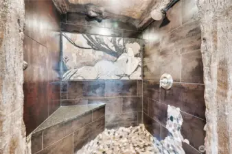 The shower features another imported natural stone mosaic of a well-known 1899 masterpiece by Alphonse Mucha called “Dusk.”