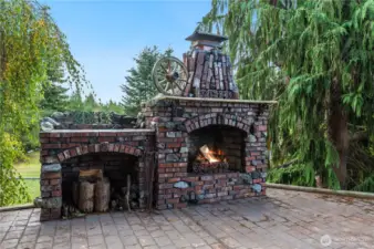 Enjoy a cozy outdoor fire in this fireplace built by Master Mason Bruce Aalmo using reclaimed 1930s bricks.