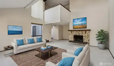 Virtually staged to showcase a warm, welcoming gathering space.