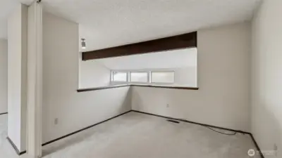 A quiet, private loft just off the primary suite—perfect for a reading nook or retreat.